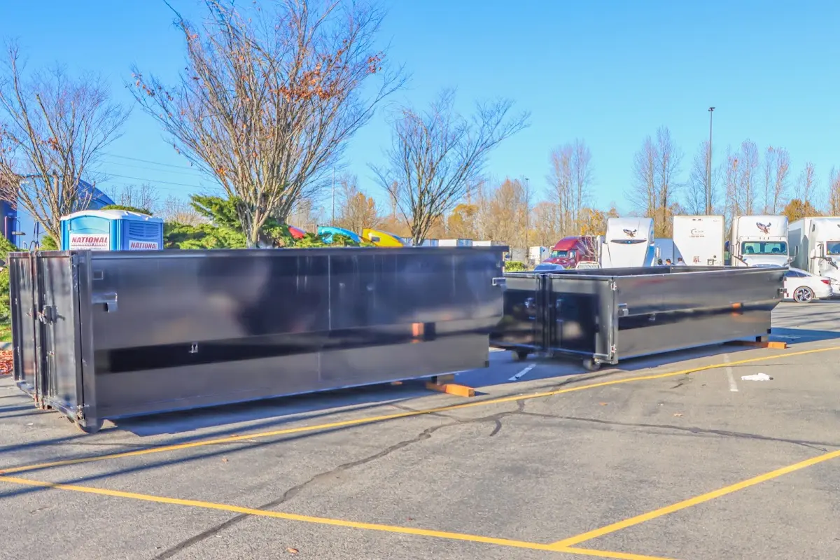 Professional dumpster rental service with roll-off container on residential driveway in Canal Winchester